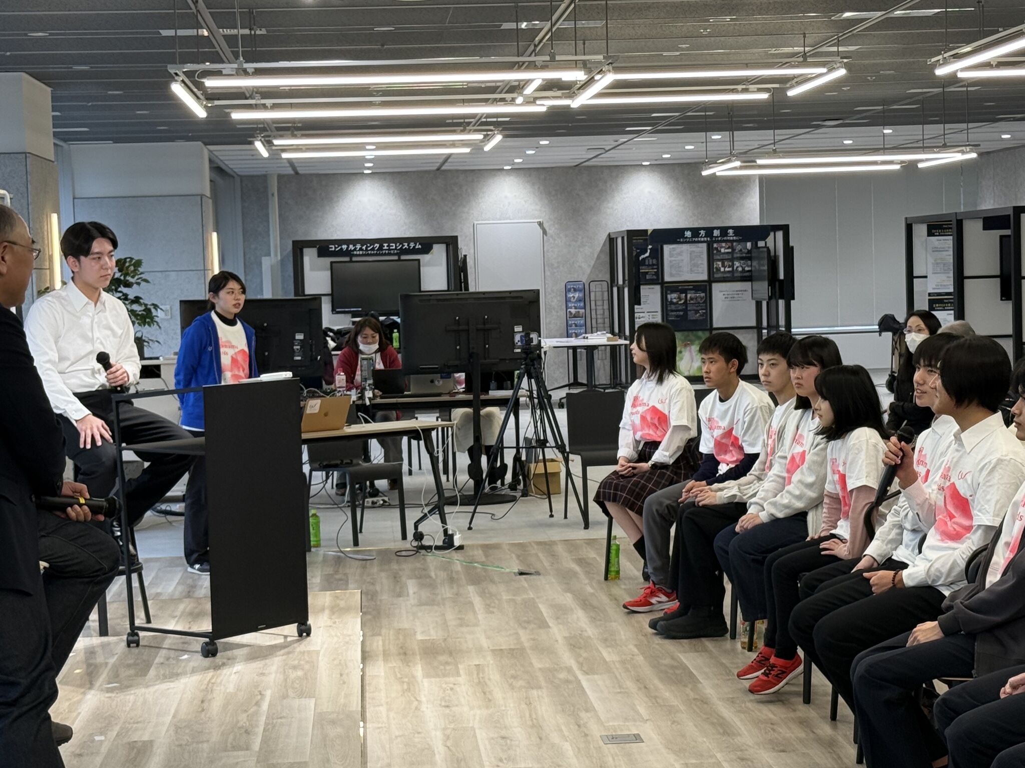 Tianyi Huang listening as a student speaks during a group discussion at the Japan Wagamama Awards 2025