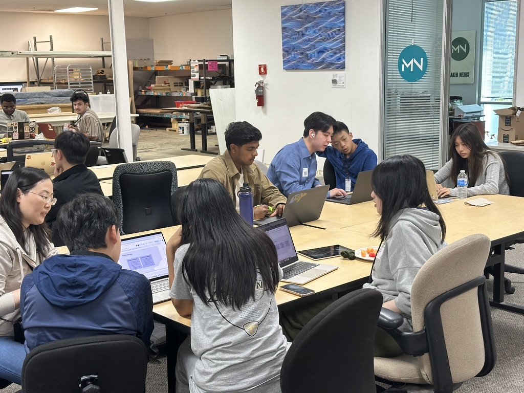 Participants working together on laptops during the Silicon Valley workshop